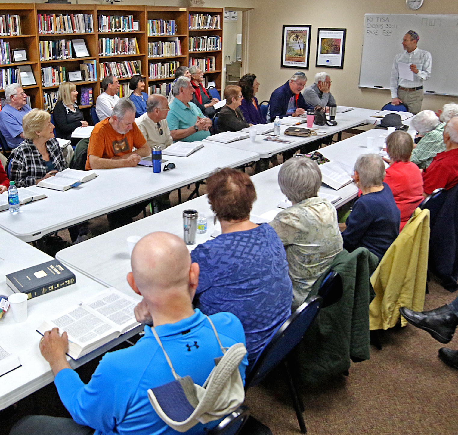 Adults studying together around a table